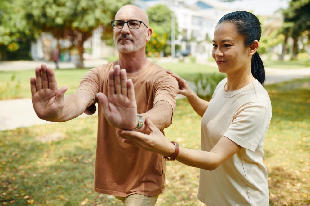 Tai Chi Class Tai Chi Instructor corrects student